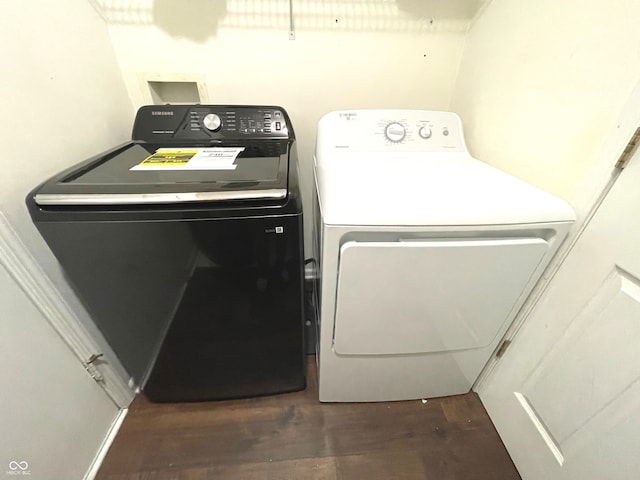 laundry room featuring independent washer and dryer and dark hardwood / wood-style floors