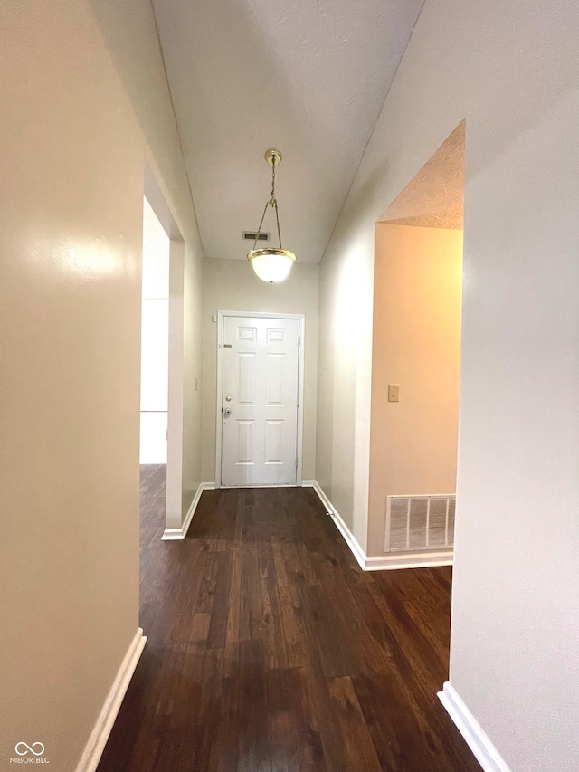 hall with dark hardwood / wood-style floors