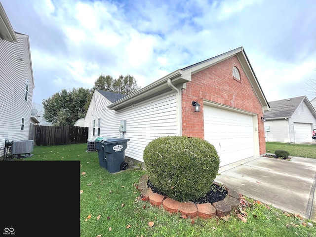 view of home's exterior featuring a yard and central air condition unit