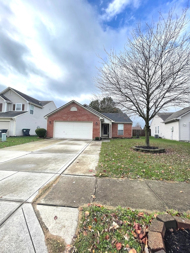 view of front facade with a garage and a front yard