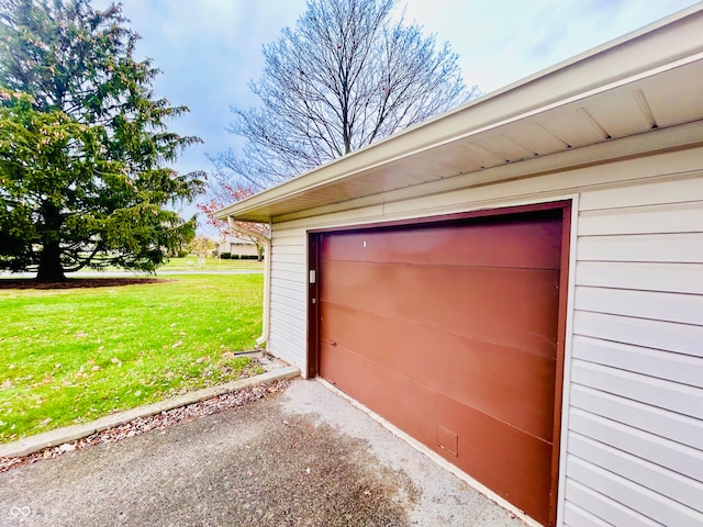 garage featuring a yard