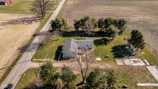 birds eye view of property with a rural view