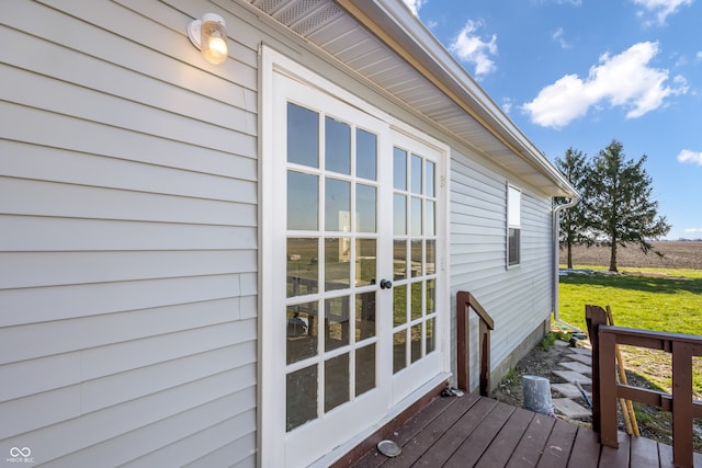 exterior space with a lawn and french doors