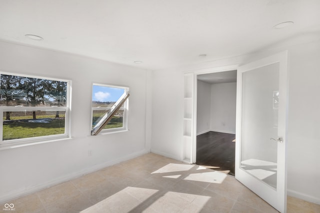 unfurnished bedroom featuring light tile patterned flooring