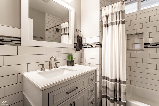 bathroom featuring vanity and shower / tub combo with curtain