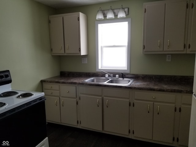 kitchen featuring dark hardwood / wood-style flooring, white cabinetry, sink, and white electric stove