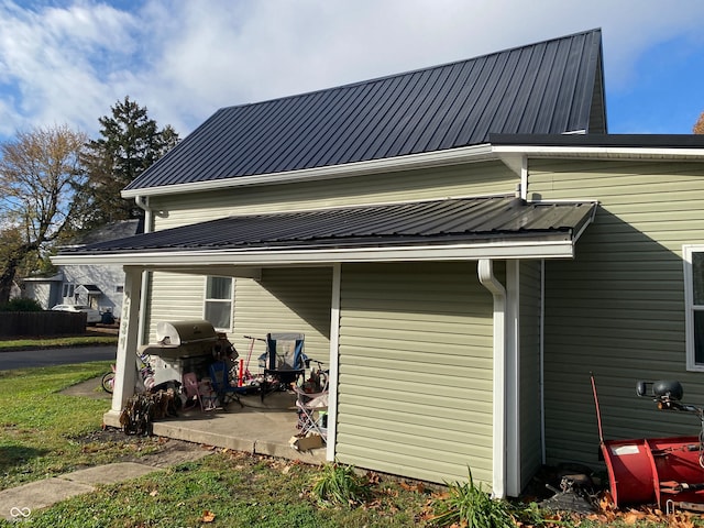 view of side of home featuring a patio area