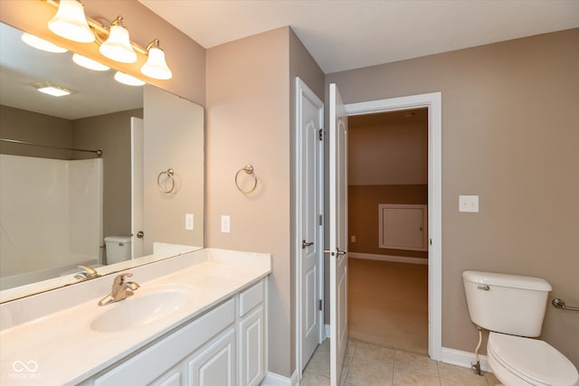 full bath with baseboards, vanity, toilet, and tile patterned floors