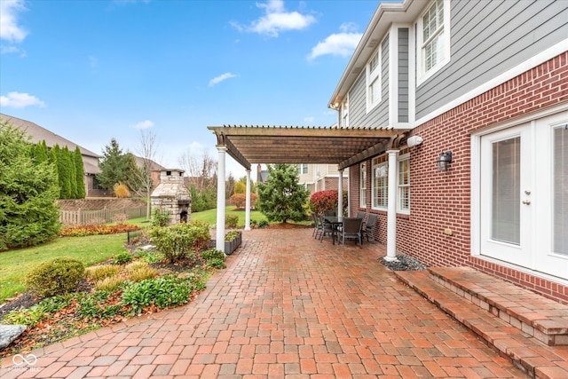 view of patio with fence and a pergola