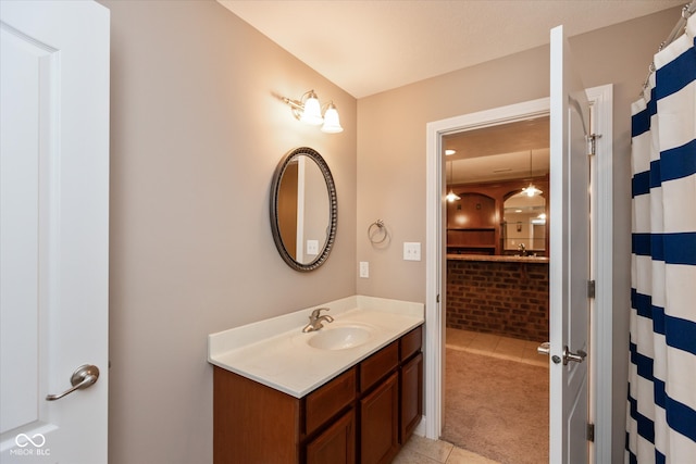 bathroom with tile patterned flooring, vanity, and a shower with shower curtain