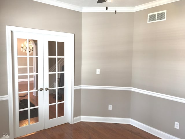 interior space featuring french doors, wood finished floors, visible vents, and crown molding