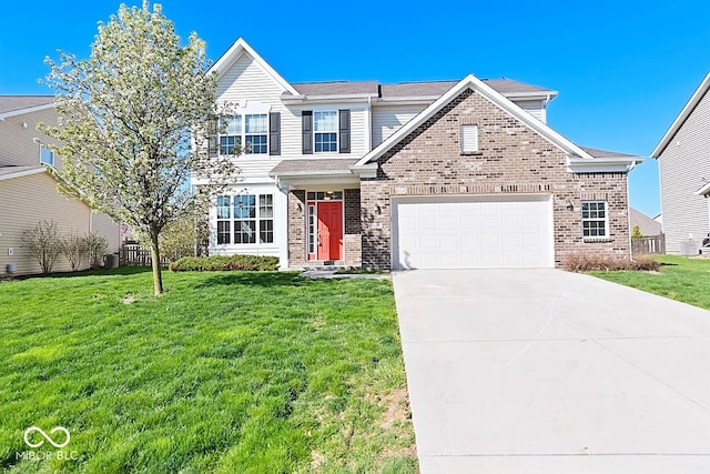 view of front of property featuring a garage and a front yard