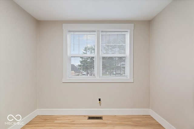 spare room featuring hardwood / wood-style floors