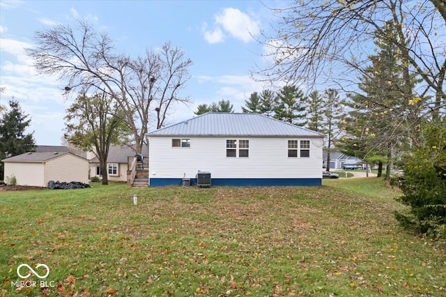 view of property exterior featuring a yard and central air condition unit