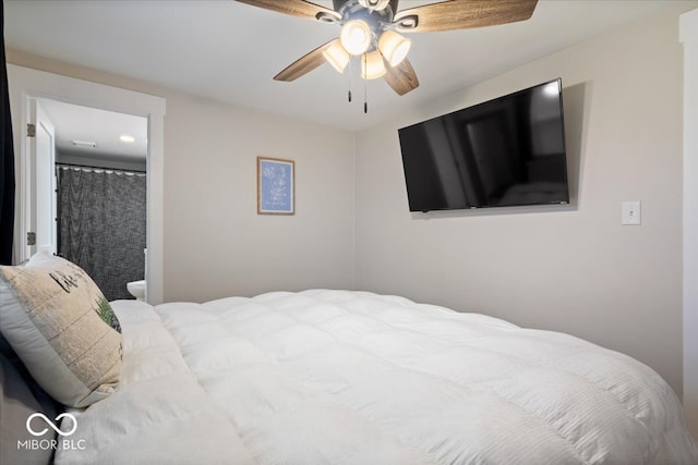 bedroom with connected bathroom and ceiling fan