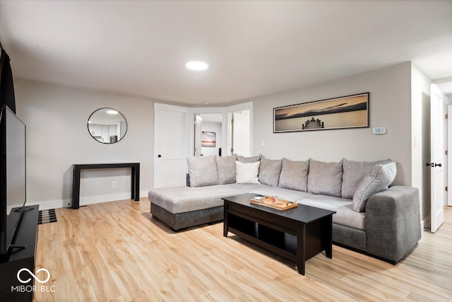 living room with light hardwood / wood-style flooring