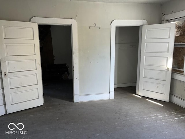 1210 N Rural St, Indianapolis, IN 46201 - unfurnished bedroom with concrete floors and a closet