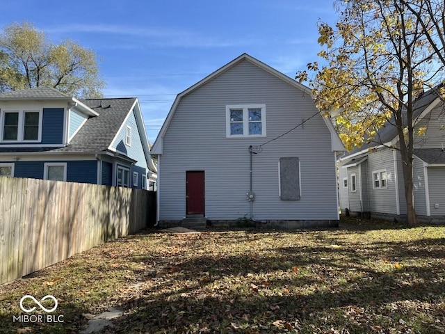 1210 N Rural St, Indianapolis, IN 46201 - back of property featuring entry steps, fence, and a gambrel roof