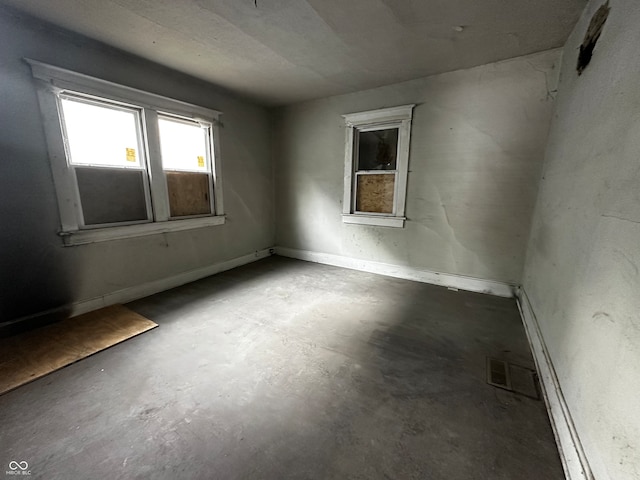 empty room featuring concrete flooring