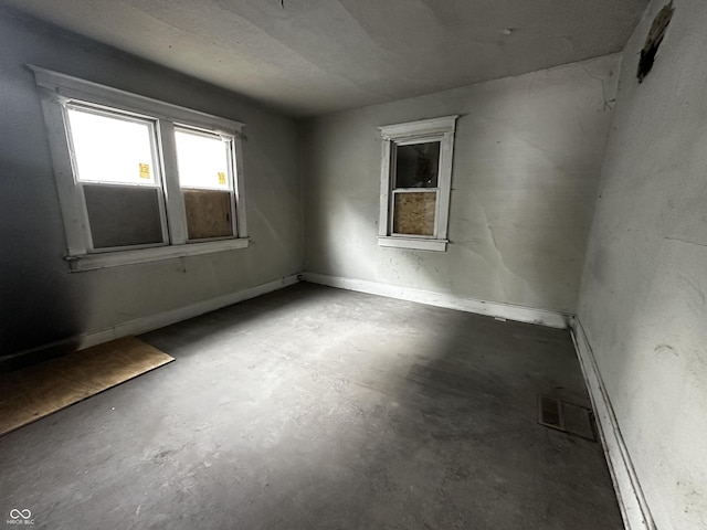 1210 N Rural St, Indianapolis, IN 46201 - spare room featuring unfinished concrete flooring