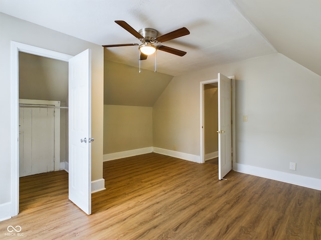 bonus room featuring ceiling fan, light wood-type flooring, and lofted ceiling