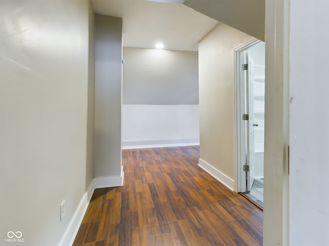 corridor with dark hardwood / wood-style floors