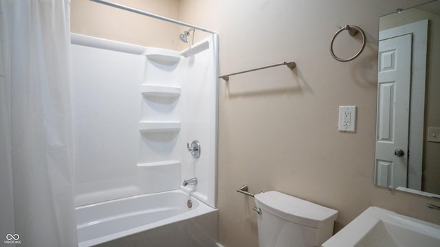 full bath with toilet, a sink, and shower / bath combination with curtain