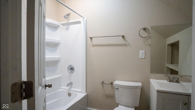 bathroom featuring washtub / shower combination, toilet, and vanity