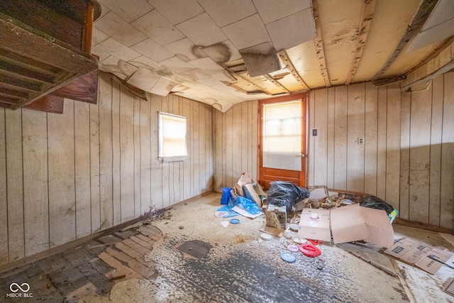 misc room featuring wood walls