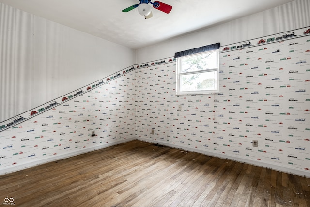 empty room featuring hardwood / wood-style floors and ceiling fan