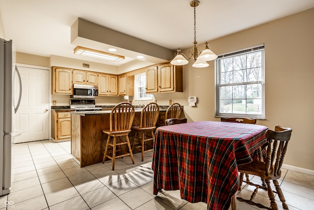 dining room with light tile patterned flooring