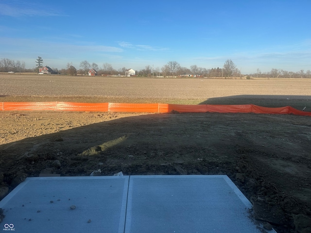 view of yard with a rural view