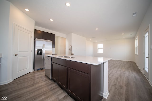 7904 Magnolia St, New Palestine, IN 46163 - kitchen with a sink, stainless steel fridge with ice dispenser, wood finished floors, dark brown cabinets, and recessed lighting