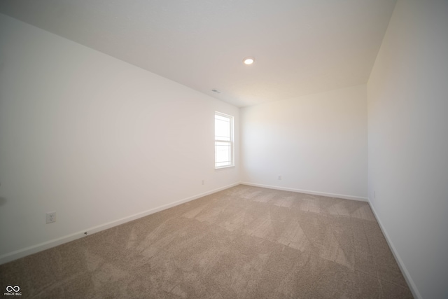7904 Magnolia St, New Palestine, IN 46163 - unfurnished room with light carpet, baseboards, and recessed lighting