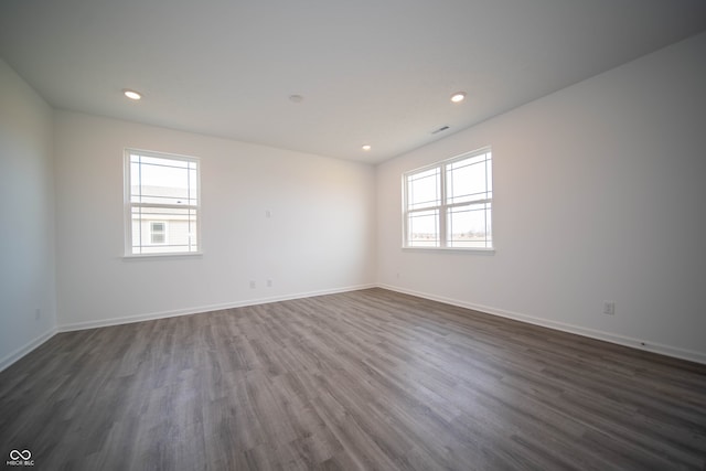 7904 Magnolia St, New Palestine, IN 46163 - spare room featuring healthy amount of natural light, dark wood-style flooring, baseboards, and recessed lighting
