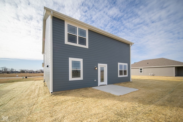 7904 Magnolia St, New Palestine, IN 46163 - back of house with a patio and a lawn