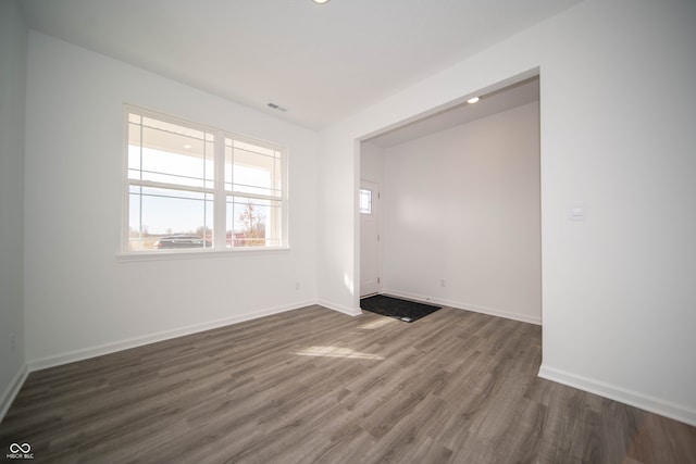 7904 Magnolia St, New Palestine, IN 46163 - empty room with dark wood finished floors, baseboards, and recessed lighting