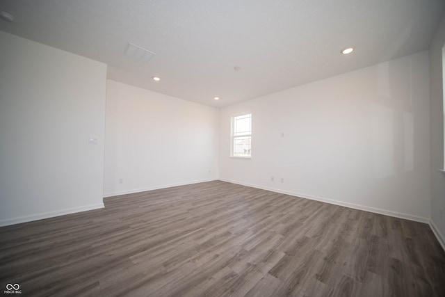 7904 Magnolia St, New Palestine, IN 46163 - spare room featuring wood finished floors, recessed lighting, and baseboards
