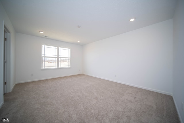 7904 Magnolia St, New Palestine, IN 46163 - unfurnished room with light carpet, baseboards, and recessed lighting