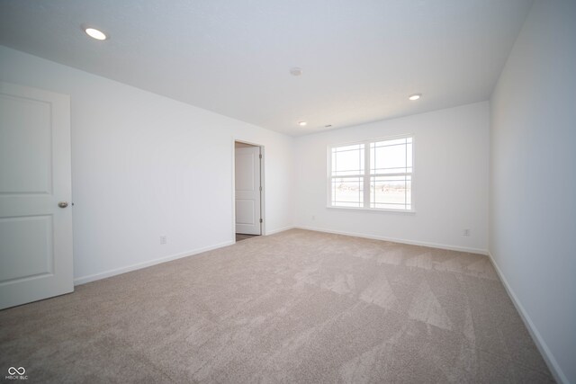 7904 Magnolia St, New Palestine, IN 46163 - unfurnished room with light carpet, recessed lighting, and baseboards