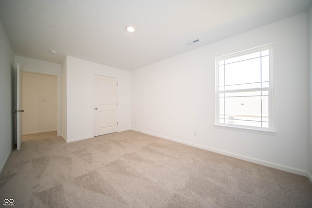 7904 Magnolia St, New Palestine, IN 46163 - unfurnished bedroom featuring light carpet and baseboards