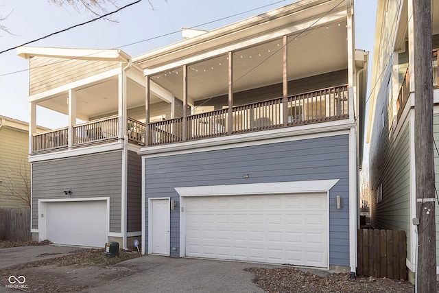 view of home's exterior featuring a balcony and a garage