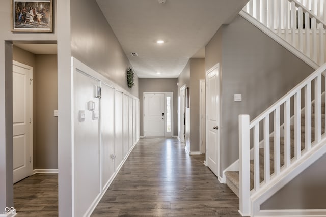 corridor featuring dark hardwood / wood-style flooring