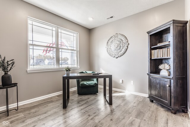 office space with hardwood / wood-style flooring