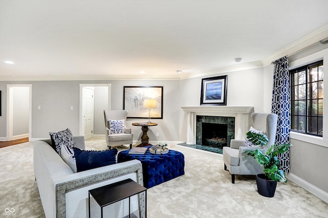 carpeted living room with ornamental molding and a high end fireplace