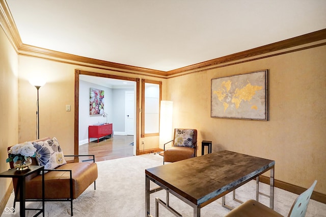 sitting room with light hardwood / wood-style floors and ornamental molding