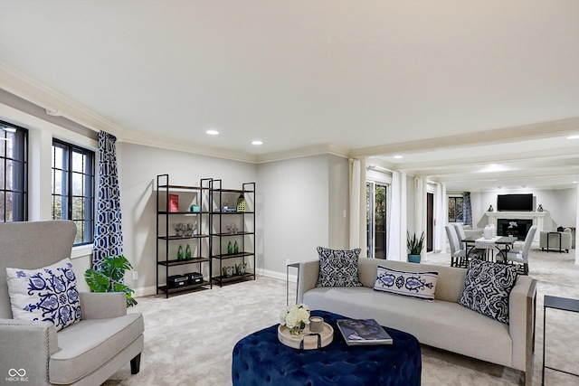 living room featuring a healthy amount of sunlight, crown molding, and light carpet