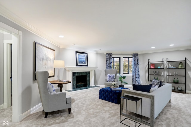 living room with a high end fireplace, crown molding, and carpet floors