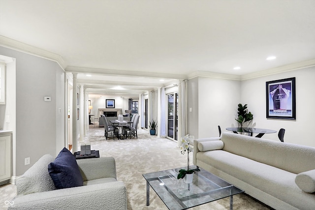 carpeted living room featuring ornamental molding