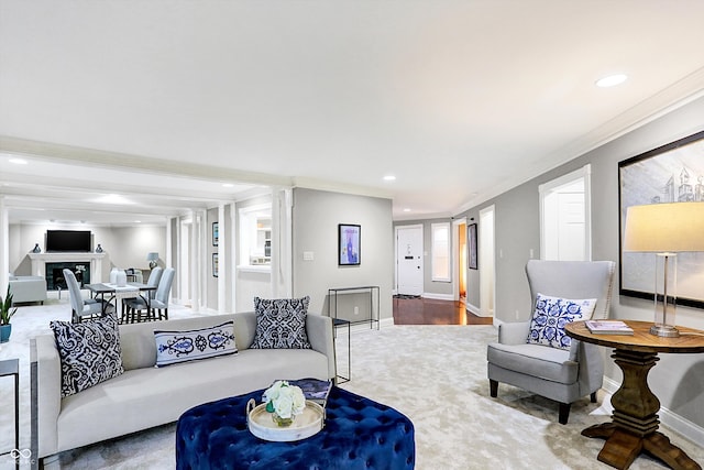 living room with wood-type flooring and ornamental molding